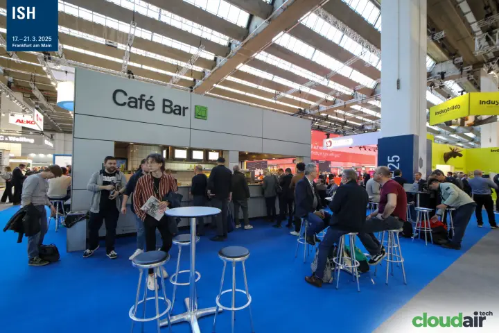 Café Bar with high tables on blue carpet in the hall