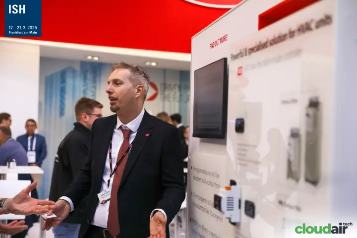 Carel staff presenting controllers for HVAC units at a display wall at ISH 2025