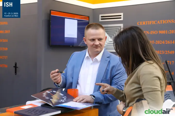 Catalogue discussion at a grille and diffuser stand