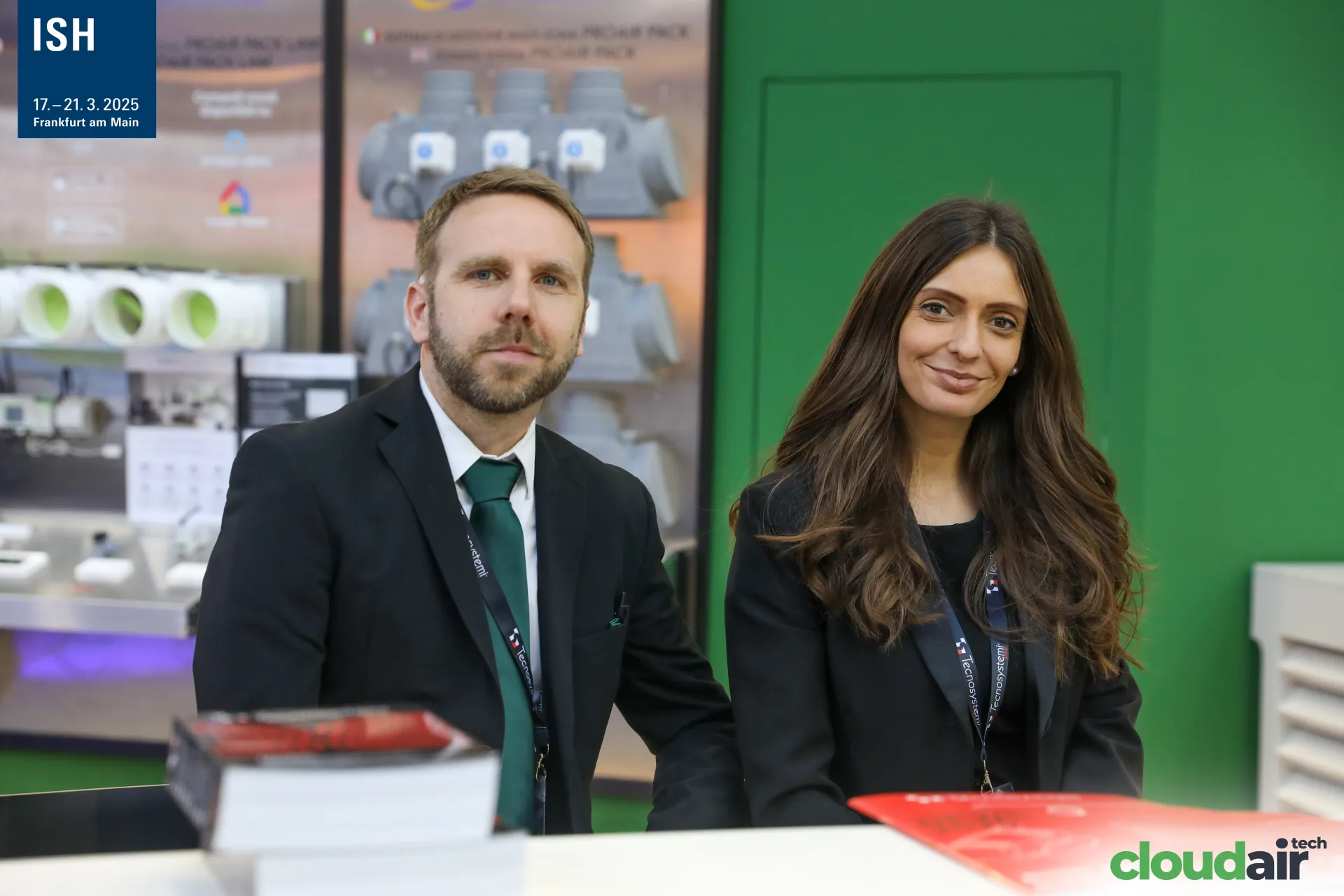 Closer portrait of the Tecnosystemi team at the stand counter at ISH 2025