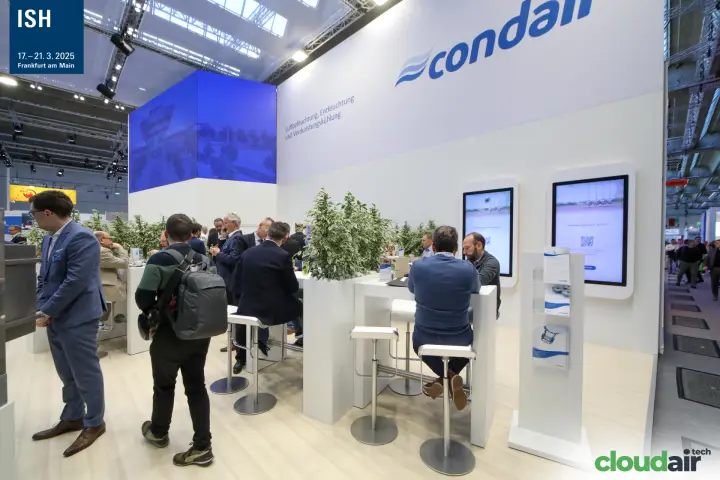 Condair meeting area with bar tables and portrait screens at ISH 2025