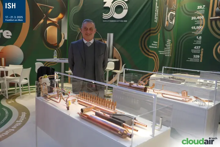 Copper HVAC-R components in glass cases at a 30-year anniversary stand