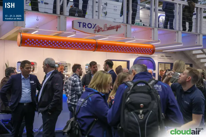 Crowded TROX AirLounge bar under an orange textile air duct at ISH 2025