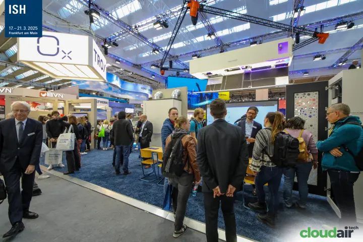 Crowded TROX stand with blue carpet and hanging TROX cube at ISH 2025