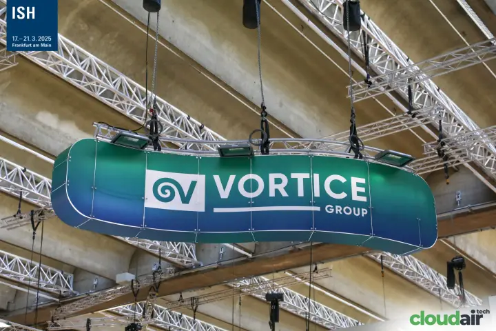 Curved Vortice Group banner hanging from the hall roof trusses at ISH 2025