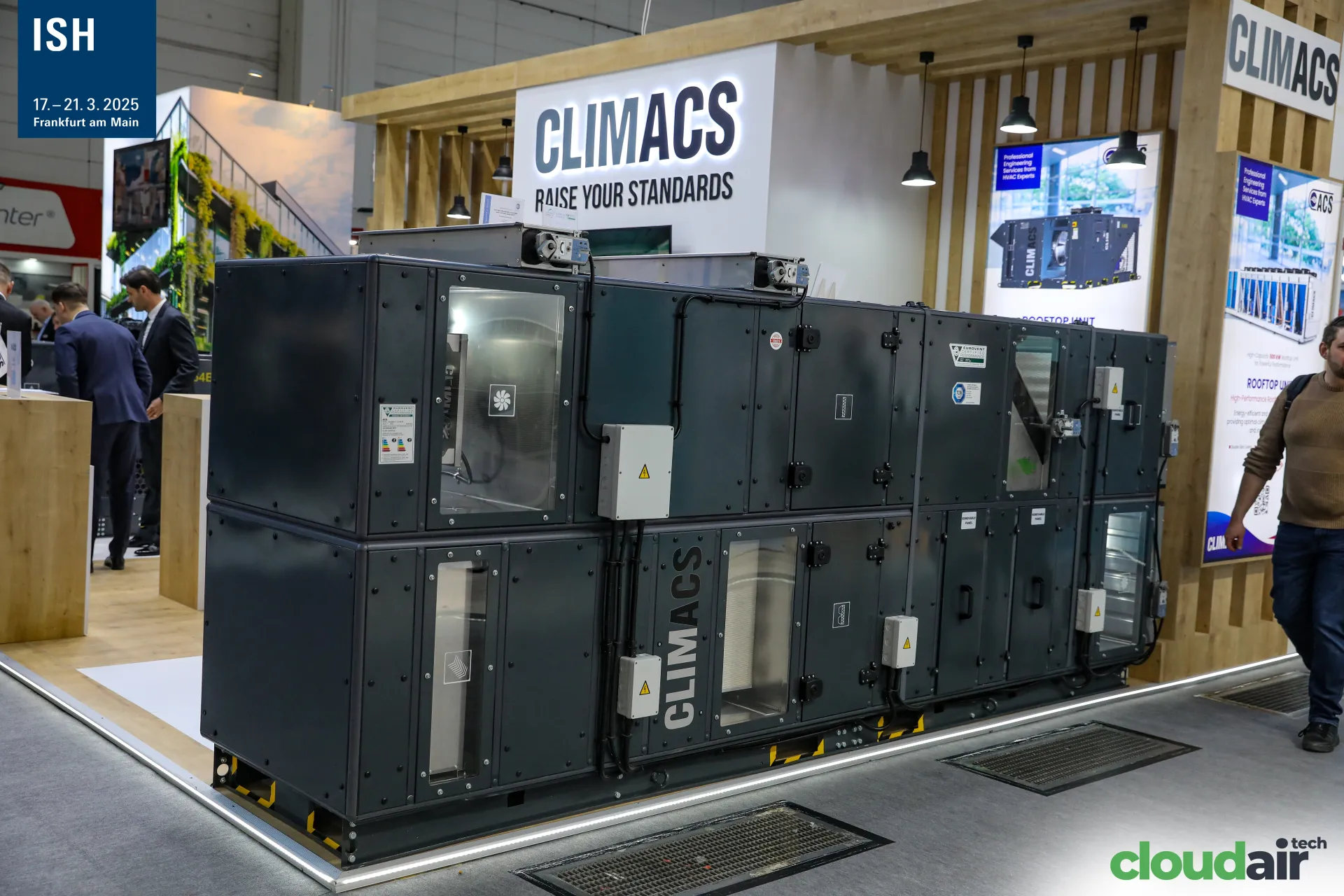 Dark grey Climacs air handling unit in front of a timber-slatted stand at ISH 2025