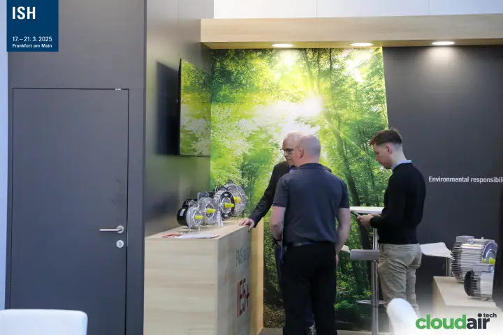 Domel 'PMS motors IE5+' counter in front of a forest backdrop at ISH 2025