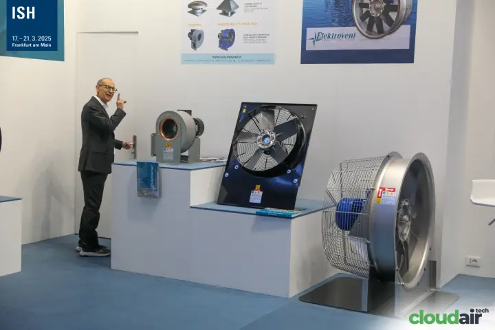 Elektrovent staff presenting ATEX fans beneath product posters at ISH 2025