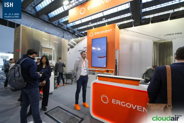 Ergovent orange counter with linear diffuser sample and hanging banner at ISH 2025