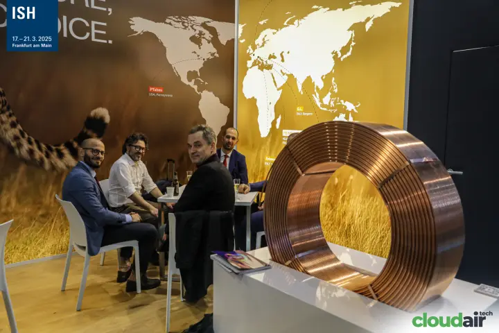 Feinrohren meeting area behind a large copper tube coil