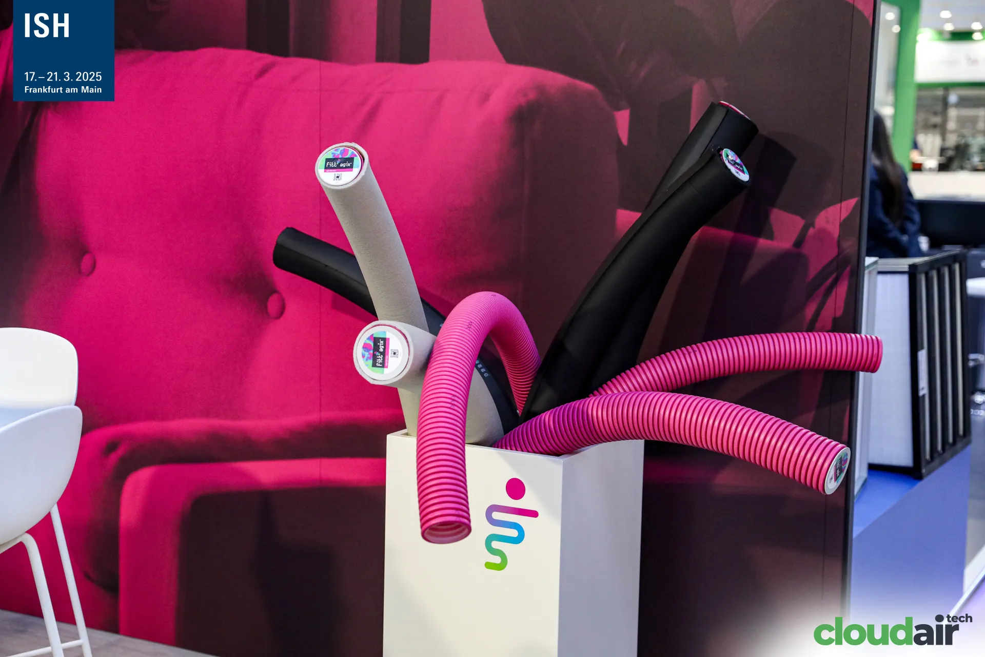 FITT Agix pipe insulation and magenta corrugated conduits in a display box at ISH 2025
