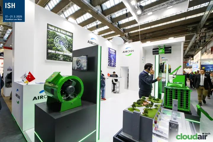 Green axial fan on a black plinth at the Aironn stand at ISH 2025
