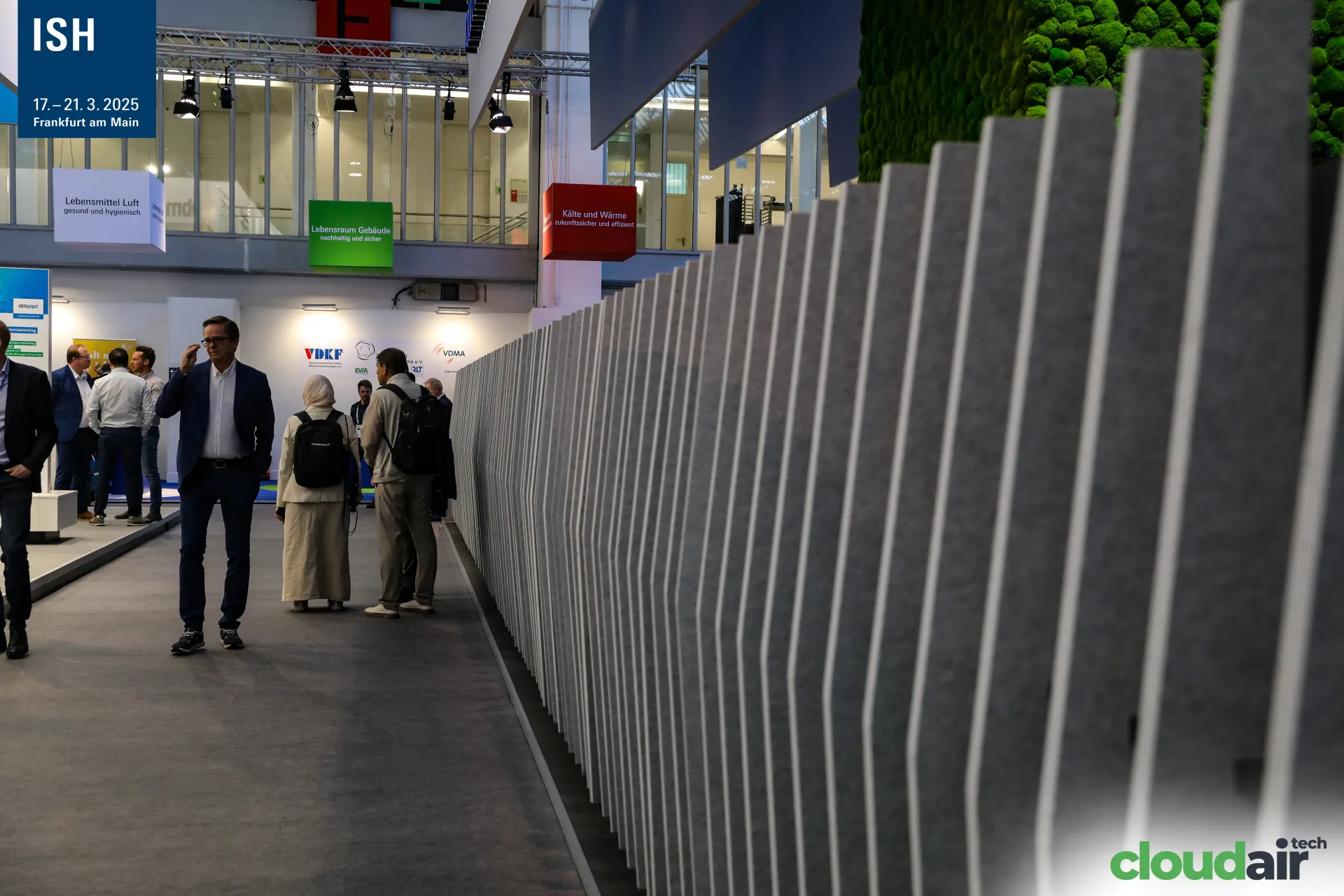 Grey felt fin wall and moss cube lining the aisle at the robatherm stand at ISH 2025