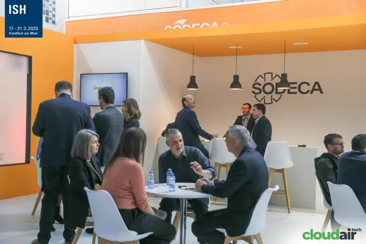 Guests meeting at round tables under the Sodeca logo at ISH 2025