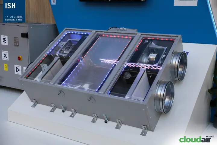 Heat recovery unit with transparent covers and LED-lit interior on Blauberg stand at ISH 2025