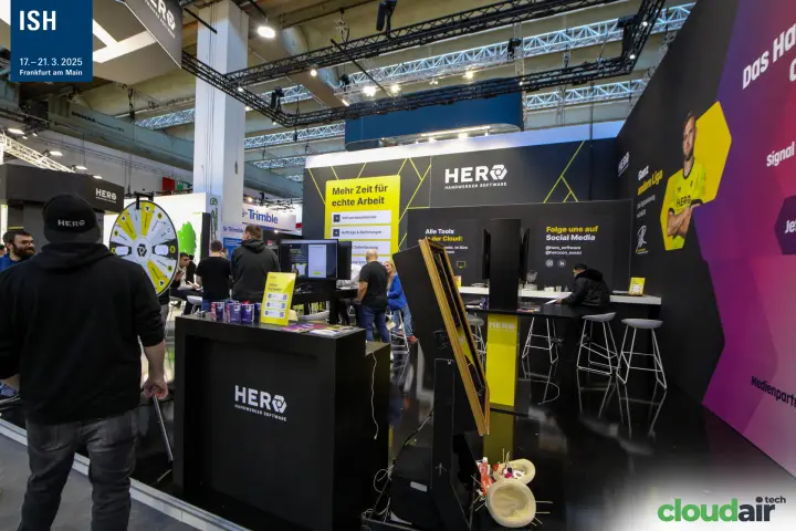 HERO Handwerker Software stand with prize wheel and demo screens