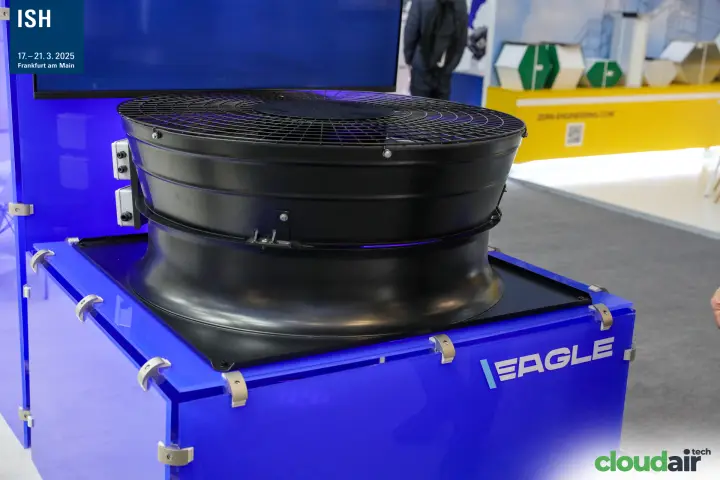 Hidria EAGLE axial fan with guard on a blue acrylic display base at ISH 2025