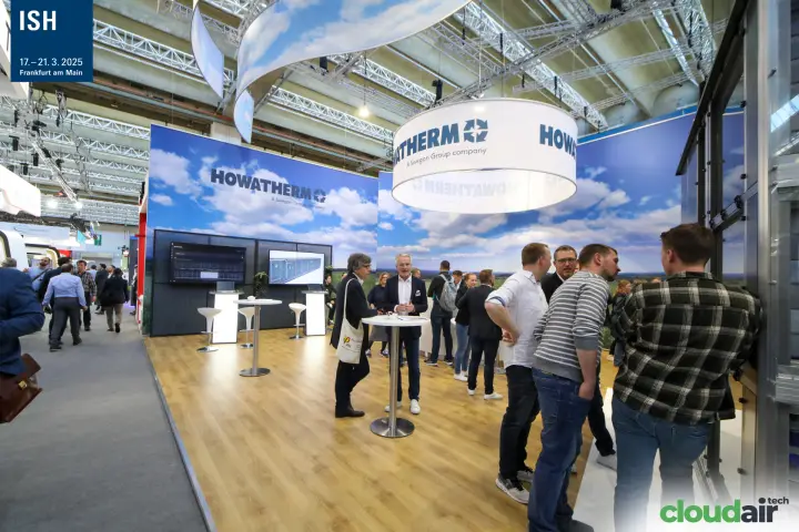 Howatherm stand meeting area under suspended logo drum
