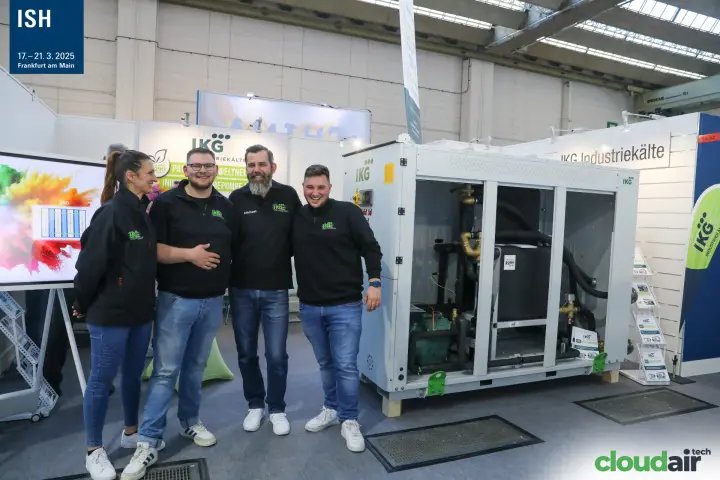 IKG Industriekälte team beside an open R290 industrial heat pump unit at ISH 2025