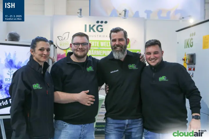 IKG Industriekälte team portrait in front of their R290 heat pump display at ISH 2025