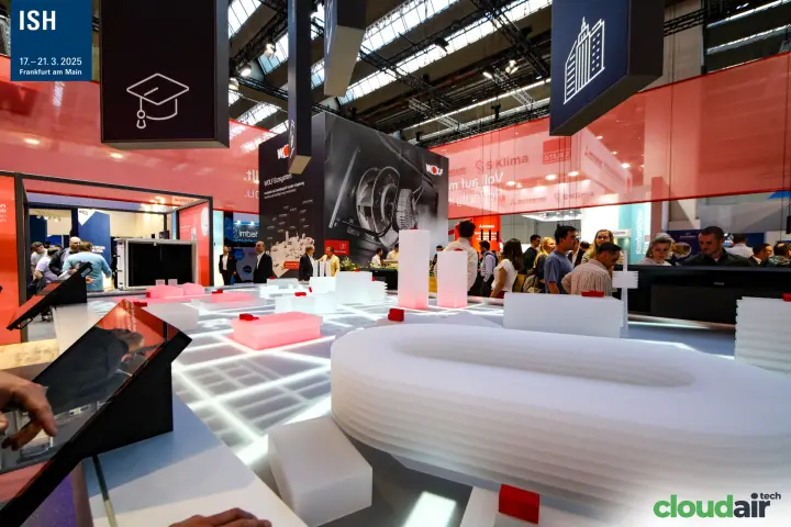 Illuminated city model with touchscreens on the Wolf stand at ISH 2025