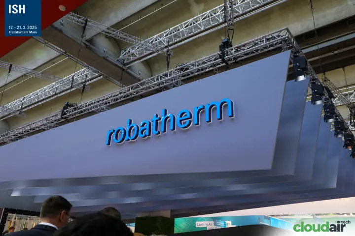Illuminated robatherm logo on a suspended layered canopy at ISH 2025