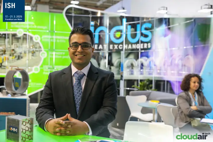 Indus Heat Exchangers representative at the counter with copper coil samples at ISH 2025