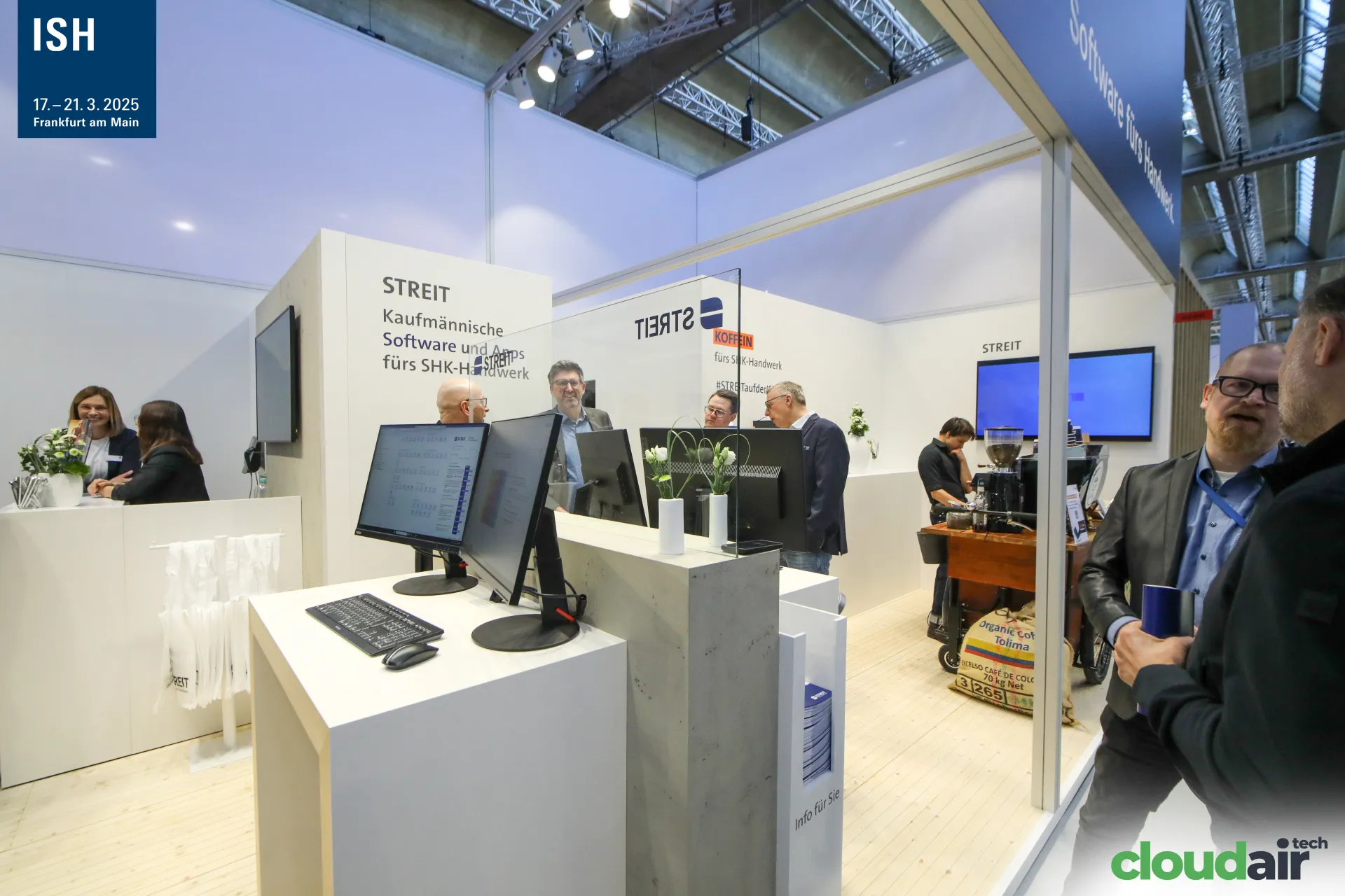 Inside the Streit stand with demo monitors and a coffee bar at ISH 2025