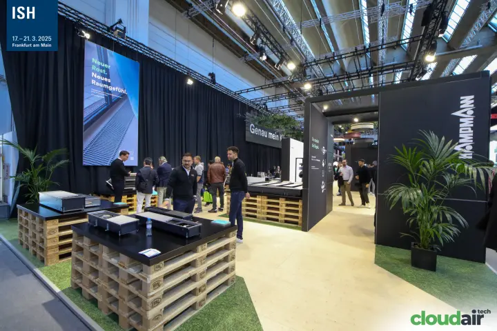 Kampmann floor convectors displayed on pallets at the stand entrance at ISH 2025