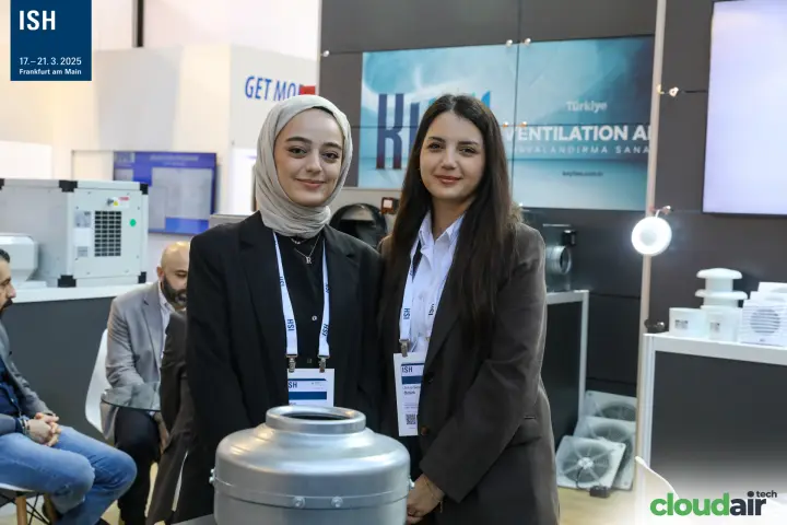 Kayi team portrait beside axial wall fans and roof cowls