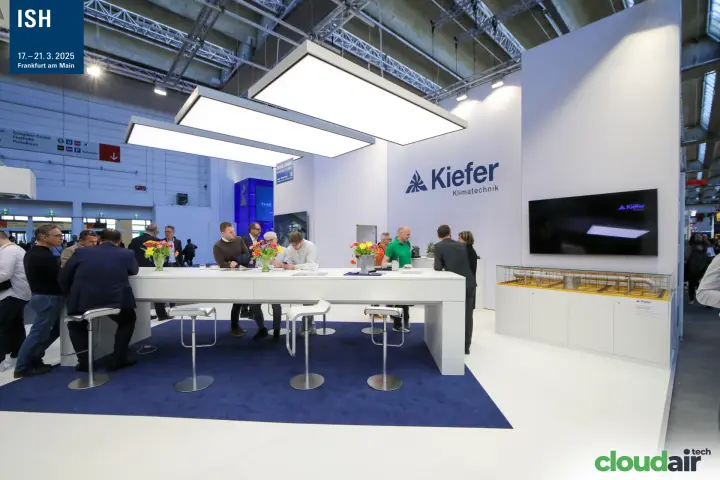 Kiefer Klimatechnik stand with long white table and suspended light panels at ISH 2025