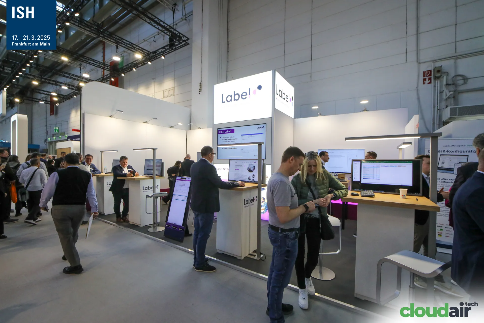 Label software stand with illuminated logo tower and demo desks at ISH 2025