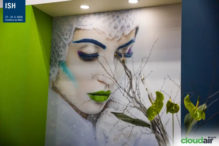 Large portrait artwork framed by lime-green and navy stand walls