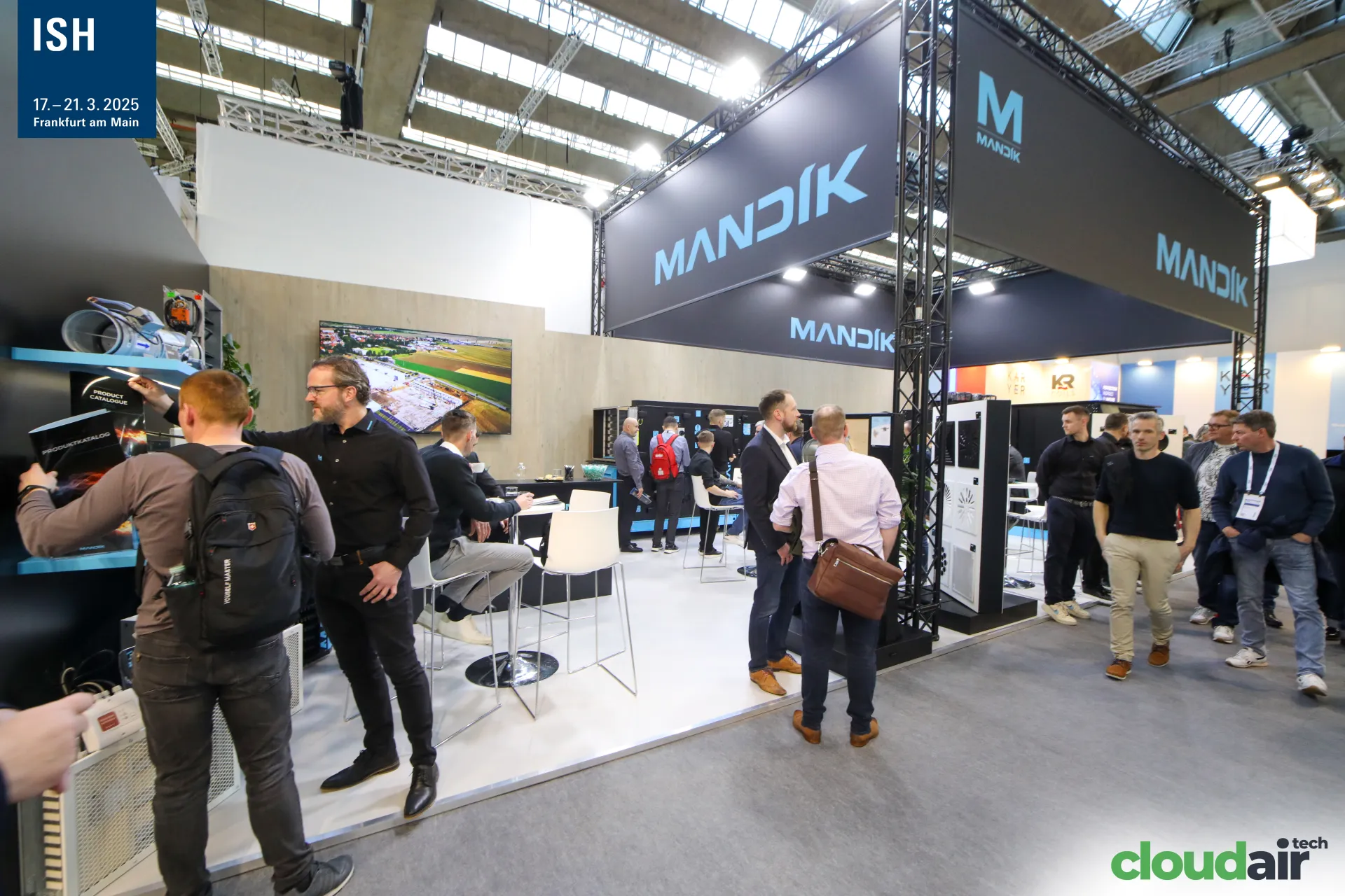 Mandík stand with black truss frames, damper display and product catalogue at ISH 2025