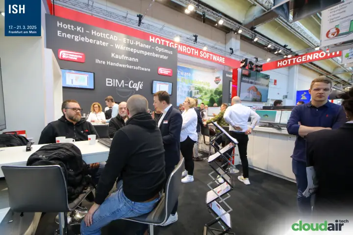 Meeting tables in front of the Hottgenroth BIM-Café wall at ISH 2025