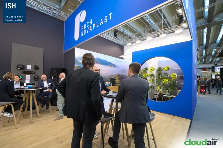 Meeting tables under the blue Ruch Novaplast fascia at ISH 2025