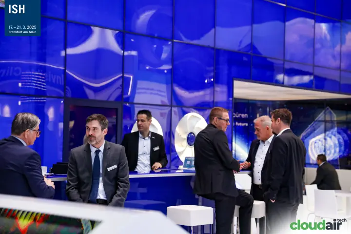 Meetings at the Ziehl-Abegg counter beside white axial impellers