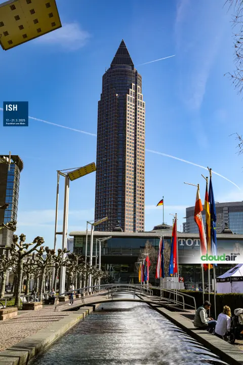Messeturm skyscraper above the fountain channel, portrait view