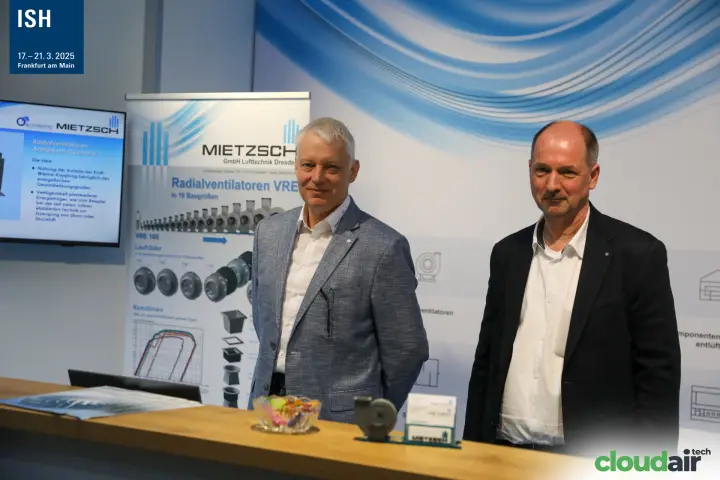 Mietzsch staff beside the "Radialventilatoren VRE" roll-up banner