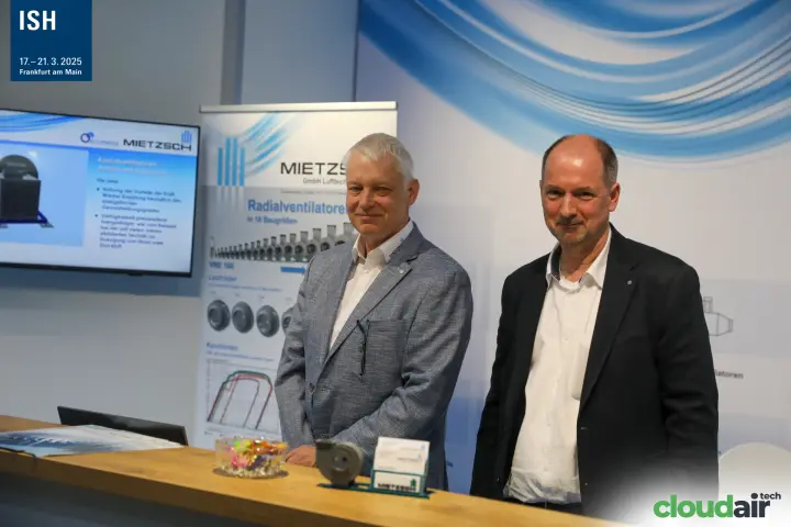 Mietzsch team at the counter with radial fan banner and screen at ISH 2025
