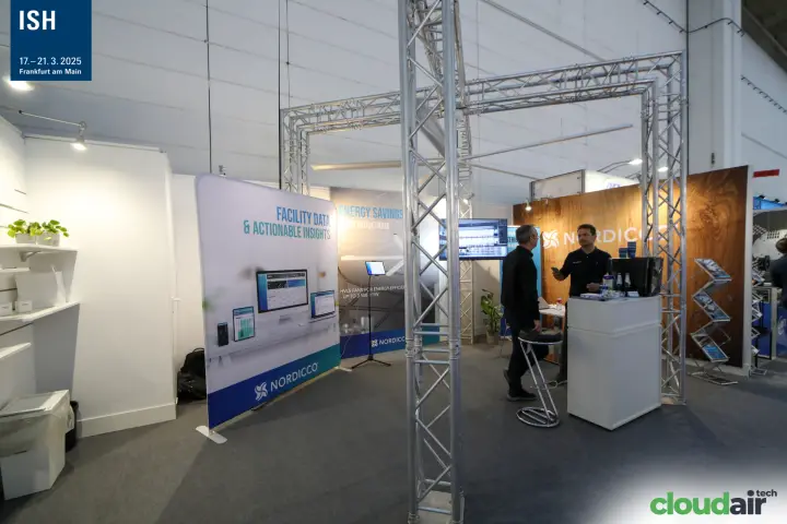 Nordicco stand with Facility Data banner and HVLS fan graphics