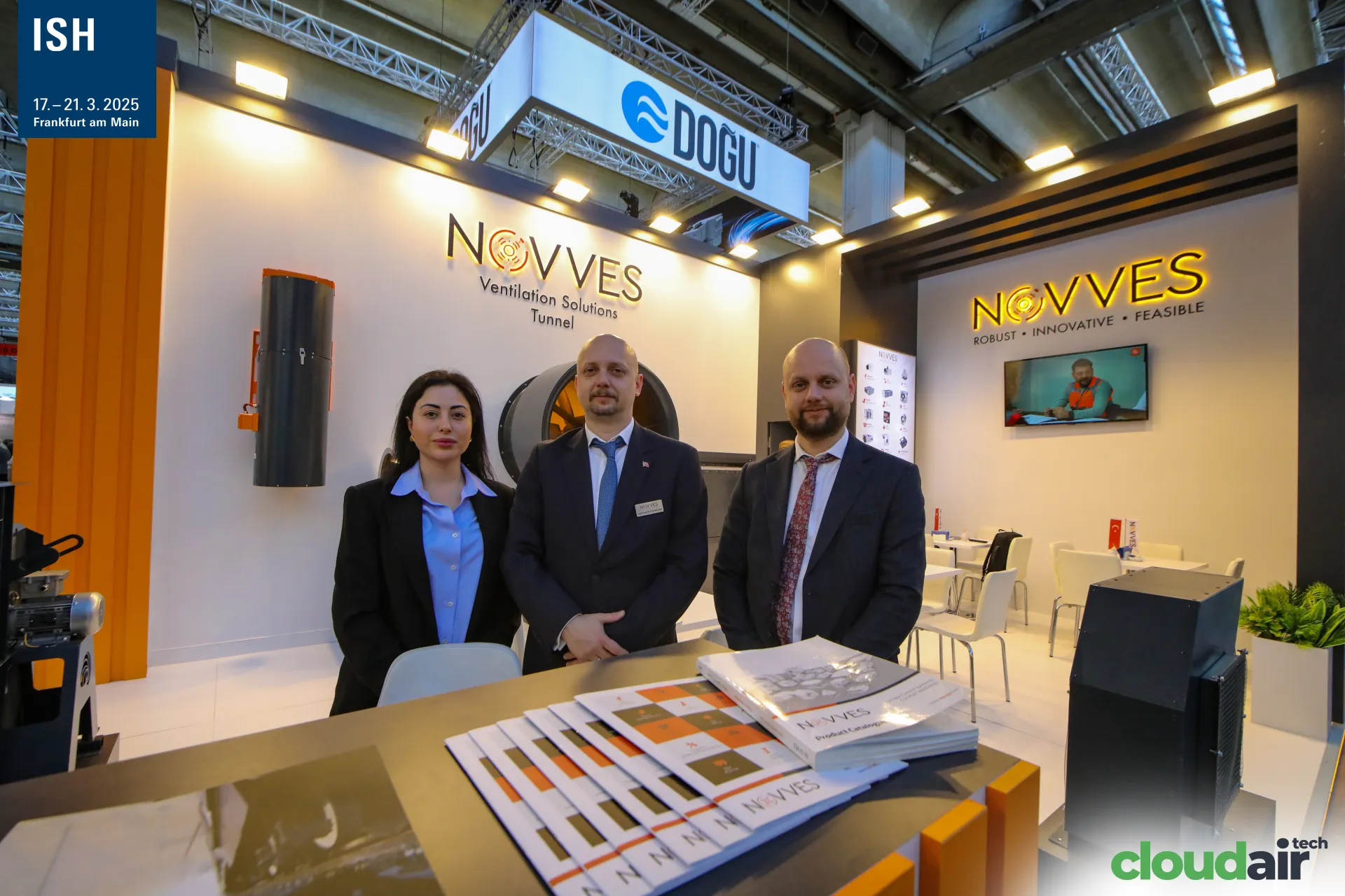 Novves staff with the product catalogue and tunnel fan display at ISH 2025