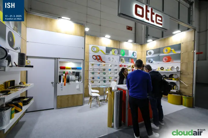 Otte stand under its illuminated red logo with tape and foam rolls at ISH 2025