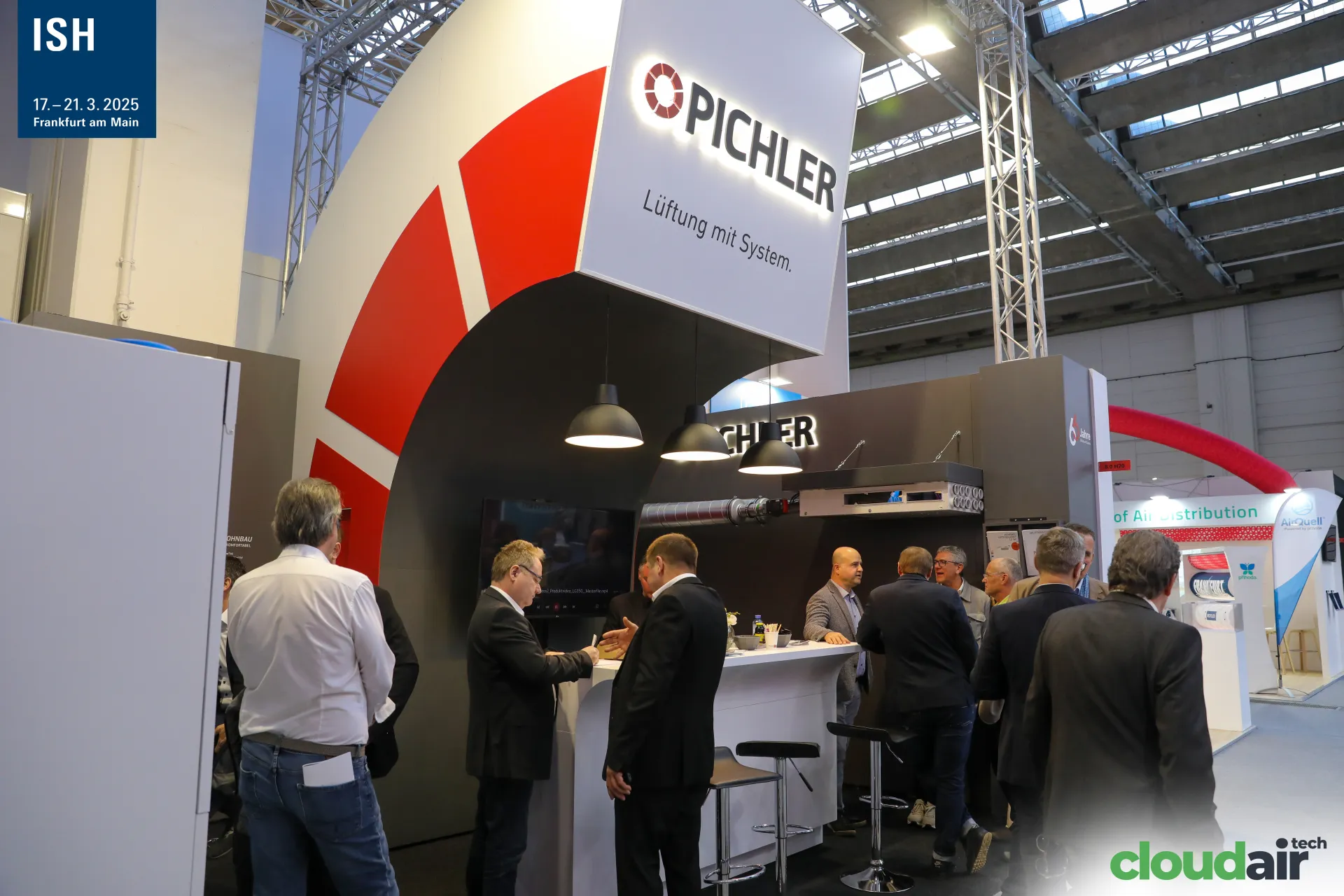 Pichler stand with red duct-bend arch and illuminated logo at ISH 2025