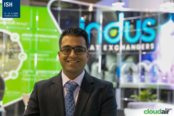 Portrait in front of the illuminated Indus Heat Exchangers logo at ISH 2025