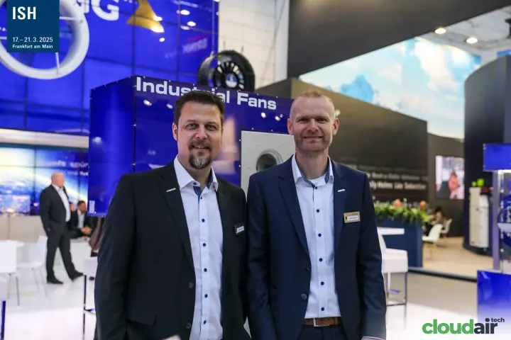 Portrait of two Ziehl-Abegg staff by the Industrial Fans cube at ISH 2025