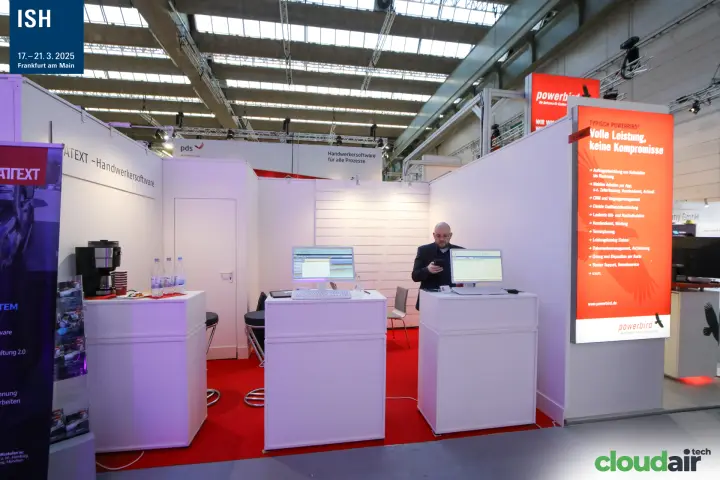 Powerbird lightbox beside a white booth with red carpet at ISH 2025