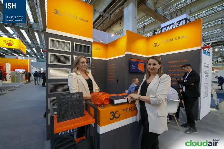 RDJ Klima staff portrait beside grilles and orange plenum box at ISH 2025