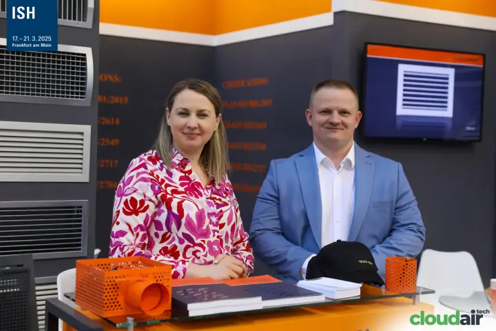 RDJ Klima team at the counter with catalogues and a perforated plenum box at ISH 2025
