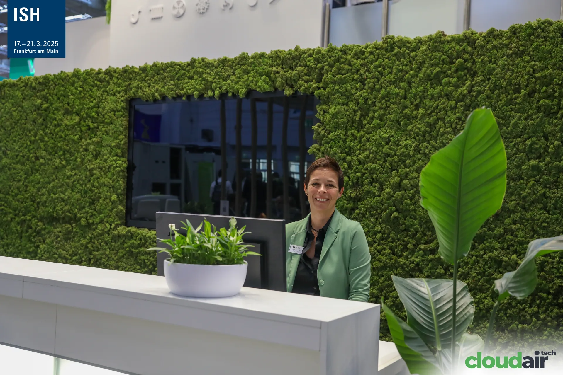 Reception desk in front of the Linear moss wall at ISH 2025